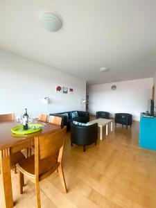 a living room with a table and a couch at Amazing Views in Machico in Machico