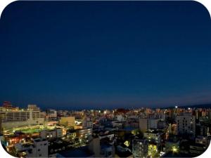 a view of a city skyline at night at Hotel Brisbanes - Vacation STAY 65781v in Miyazaki