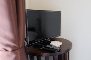a tv sitting on top of a table at Kittawan Home&Gallery in Chiang Mai