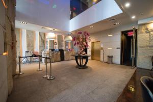 TV a/nebo společenská místnost v ubytování The One Boutique Hotel