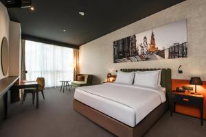Voodi või voodid majutusasutuse Crowne Plaza Podgorica by IHG toas