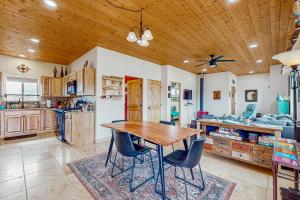 a kitchen with a wooden table and chairs at Margaritavilla in El Prado