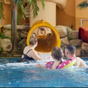 a group of people playing in a swimming pool at Luxury 8 Berth Caravan At Butlins Skegness in Skegness