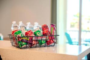 a basket of soda bottles sitting on a table at Sandbar Serenade in South Padre Island