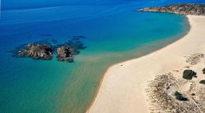 an aerial view of a beach and the ocean at Chia Laguna - Hotel Village in Chia