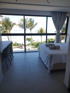 Postel nebo postele na pokoji v ubytování Beira Mar de João Pessoa, paz, tranquilidade e lazer