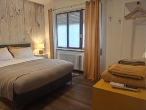 Postel nebo postele na pokoji v ubytování Valtellina -La Casina Sondrio