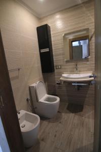 Ванна кімната в 3 Appartements Vue sur Mer dans une maison indépendante