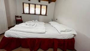 Postel nebo postele na pokoji v ubytování Silvydolomitiapartment