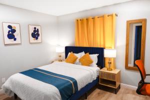 a bedroom with a blue and white bed and two lamps at Exotic Home Escondido 3 Bedroom by sdstay in Escondido +52 photos