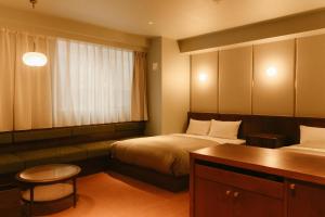 Postel nebo postele na pokoji v ubytování Hotel Vintage Tokyo Meguro Fudomae