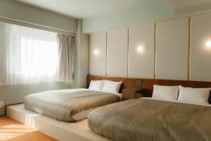 Postel nebo postele na pokoji v ubytování Hotel Vintage Tokyo Meguro Fudomae
