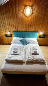 Postel nebo postele na pokoji v ubytování Silvydolomitiapartment
