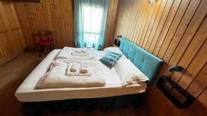 Postel nebo postele na pokoji v ubytování Silvydolomitiapartment