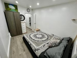 a bedroom with a bed in the corner of a room at Verb Studio - North London Enfield Self Catering Holiday - work accommodation in Enfield