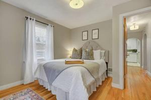 a bedroom with a large bed with a white bedspread at Kiowa Peak OCC & Downtown Basecamp in Colorado Springs