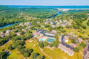 an aerial view of a resort property with a river at Pointe Royale 52-7, Golf, Indoor and Outdoor Pools in Branson