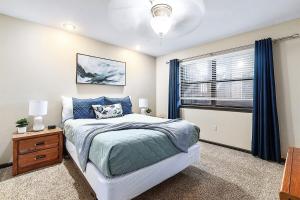 a bedroom with a bed and a window at Pointe Royale 52-7, Golf, Indoor and Outdoor Pools in Branson +50 photos