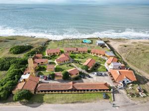 an aerial view of a house by the ocean at Complejo San Cristobal in Santa Clara del Mar