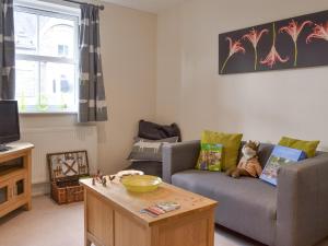 a living room with a couch and a coffee table at Rolton House in Ambleside