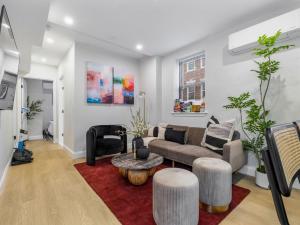 a living room with a couch and a table at North End Apt close to TD Garden Walk to Downtown in Boston