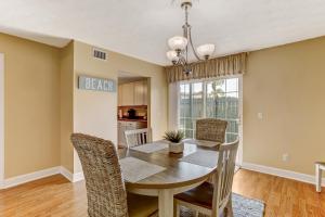 a dining room with a table and chairs at Fernandina Shores Condo in Fernandina Beach +42 photos