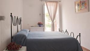 Ένα ή περισσότερα κρεβάτια σε δωμάτιο στο Albergo 'La Vigna' +37 φωτογραφίες