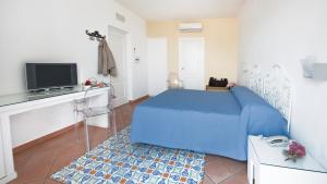 Кровать или кровати в номере Albergo 'La Vigna'