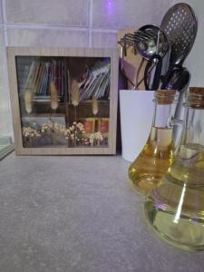 a bottle of wine sitting on a counter next to a picture at Irina in Zagreb +9 photos