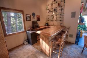 a kitchen with a large wooden bar in a room at Lake View Glen home in Lincoln Park