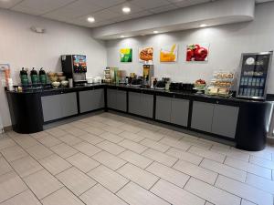 a counter in a store with food and drinks at Quality Inn & Suites Banquet Center in Livonia