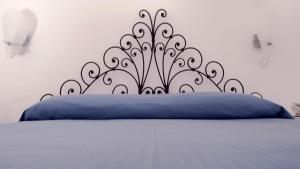 Una cama o camas en una habitación de Albergo 'La Vigna'
