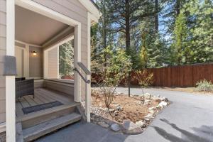 a front porch of a house with a wooden door at Raccoon Roost condo in Incline Village