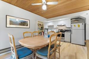a kitchen and dining room with a table and chairs at Raccoon Roost condo in Incline Village