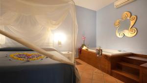 Una cama o camas en una habitación de Albergo 'La Vigna'