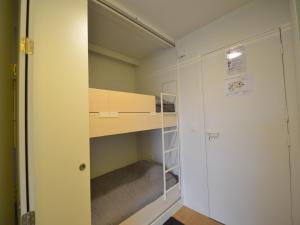 a small room with a bunk bed and a closet at Studio in Belgium near Beach & Dunes in Oostduinkerke +6 photos