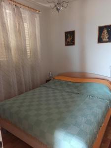 Posteľ alebo postele v izbe v ubytovaní Apartments by the sea Podgora, Makarska - 2593