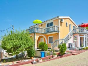 a house with an umbrella on top of it at Apartment in Croatia near Adriatic Coast in Senj