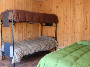 Postel nebo postele na pokoji v ubytování Cabaña con jacuzzi Olmué