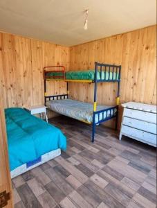 Postel nebo postele na pokoji v ubytování Cabaña con jacuzzi Olmué