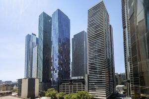 a group of tall buildings in a city at Luxuria Apartments - Uno in Melbourne