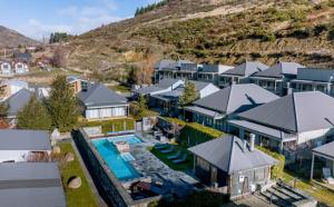 an aerial view of a house with a swimming pool at Cozy Cardrona Apartment in Cardrona