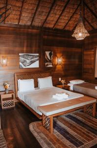 Ένα ή περισσότερα κρεβάτια σε δωμάτιο στο Atins Charme Chalés +25 φωτογραφίες