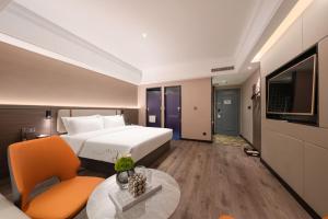 Una cama o camas en una habitación de 沃德酒店郑州大学高新校区店