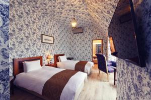Postel nebo postele na pokoji v ubytování Auberge フレンチの森