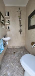 a bathroom with a toilet and a sink at Dar la famille Marrakech in Marrakech