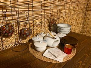 a table with a bunch of pots and pans at 仁源和 in Tokyo