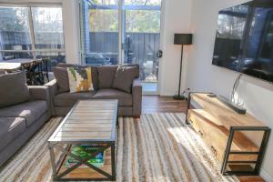 a living room with a couch and a coffee table at Hidden Haven in Bright