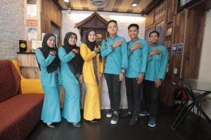 a group of people posing for a picture at DJ Citi Point Hotel in Kuala Terengganu