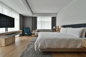 Voodi või voodid majutusasutuse Silks Club toas